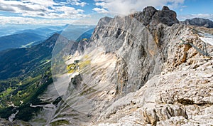 View of Hoher Dachstein from Skywalk, or Honerkogel, on a sunny summer day. Tall, rocky Alpine peaks and vast valley