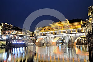 View of Hong bridge during twilight over the Tuojiang River Tuo Jiang River in Fenghuang old city Phoenix Ancient Town,Hunan