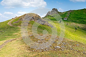 A view of Hope Bowdler Hill in Shropshire with the Gaer Stone in the Shropshire Hills Area of Natural Beauty AONB