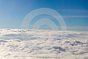 Horizon above puffy white clouds