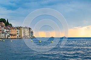 View of the horizon over the Adriatic Sea, with the typical croatian old houses in the coastline of the old town of Rovinj,