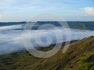 View of the horizon, sky and mountains above the clouds from afar