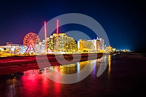 View of hotels and rides along the boardwalk at night