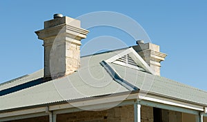 View of house roof line with view to blue sky