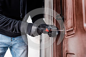 View of housebreaker in leather gloves photo