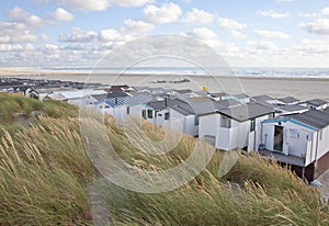 View at houses on beach with sea in IJmuiden