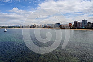 View on houses and San Lorenzo beach in Gijon, Asturias, Spain