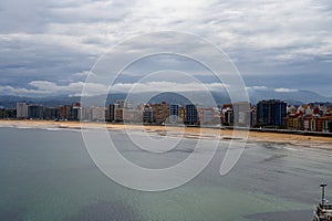 View on houses and San Lorenzo beach in Gijon, Asturias, Spain