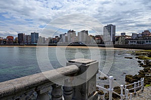 View on houses and San Lorenzo beach in Gijon, Asturias, Spain