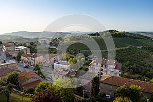 View on the houses, vineyards and hills of the historic Italian village of Cossignano