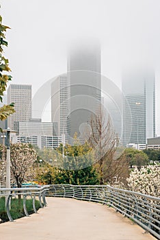 View of the Houston skyline in fog, from Buffalo Bayou Park in Houston, Texas photo