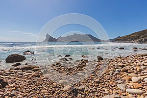 View of Hout Bay from rocky shoreline in Cape Town