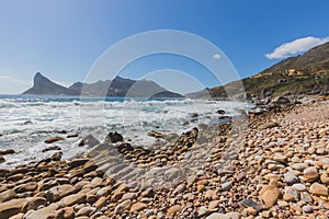 View of Hout Bay from rocky shoreline in Cape Town