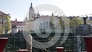 View of Hradec Kralove cityscape with bridge across Elbe river on background with White Renaissance tower and belfries