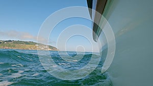 View of Hull of Sailboat Sailing with Bailey Lighthouse, Dublin