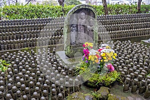 hundreds of small statues of the Jizo Bodhisattva at Hase Temple in Kamakura, Japan