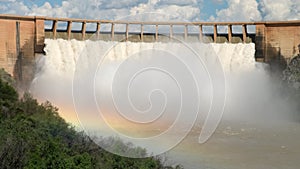 view of the hydroelectric power station dam, water discharge through locks.