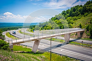 View of I-68 and a pedestrian bridge at Sideling Hill, Maryland.