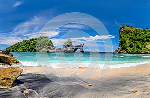 View of idyllic tropical beach with small island and perfect azure clean water