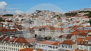 View if rich infrastructure of Lisbon with snow-white houses with red roofs