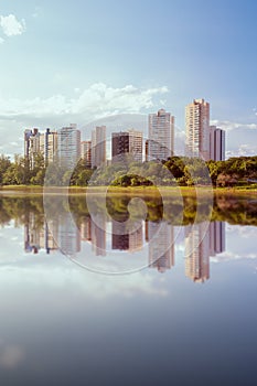 View of IgapÃ³ Lake in the city of Londrina, Brazil. Afternoon sun light. Buildings in the background