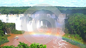 View of Iguazu waterfalls with a rainbow