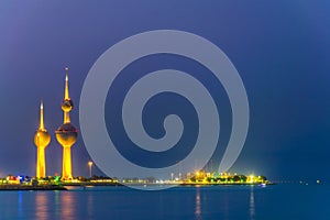 View of the illuminated Kuwait Towers - the best known landmark of Kuwait City - during night....IMAGE