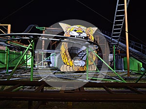 View of an illuminated roller coaster in park Wurstelprater in Vienna, Austria by night.