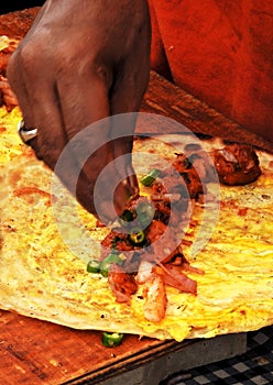 View of Indian street vendor making vegetarian spring rolls