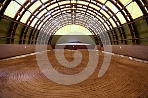 View in an indoor riding hall for horses and riders