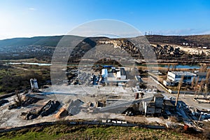 Industrial zone of a city near a river with building equipment