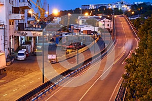 View of the industrial port in the evening - the road and railway for deliver goods to the ships for transportation by sea