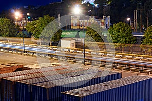 View of the industrial port in the evening - the road and railway for deliver goods to the ships for transportation by sea