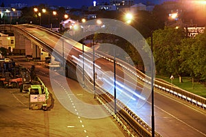 View of the industrial port in the evening - the road and railway for deliver goods to the ships for transportation by sea