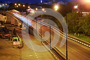 View of the industrial port in the evening - the road and railway for deliver goods to the ships for transportation by sea