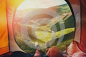 View from inside a tent on the mountains in Elbrus, Point Of View Shot. Travel Destination Hiking Adventure Concept photo