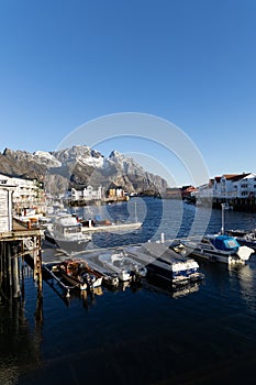 View of the inner harbour of Henningsvær in Lofoten, Norway on a beautiful fall day