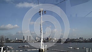 View inside of cable car over the River Thames in London on a summer day. Action. Breathtaking cityscape from the