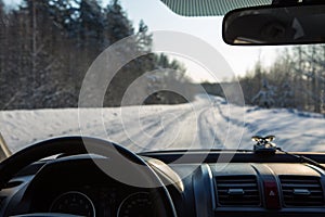 View from inside the car on the snow-covered road