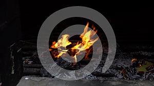 View inside a chinese temple furnace, burning joss papers.