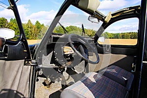 View inside classic French cult car 2CV on front seat, dashboard and steering wheel