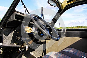 View inside classic French cult car 2CV on front seat, dashboard and steering wheel