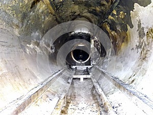 View from inside the end divider of the tube phases. Cleaning of equipment. Sediment of oil deposits on equipment