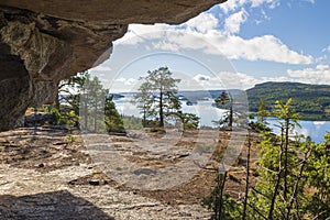 View from inside a little cave on a mountain Getsvedjberget in the High Coast area i Vasternorrland Sweden photo