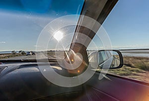 A view from inside of a modern car driving along the highway