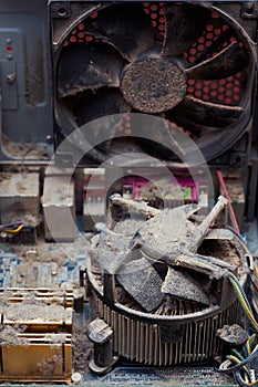 View inside the personal computer. Lot of dust on the motherboard, processor and cooling radiator