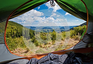 View from inside a tent on a beautiful mauntain landscape