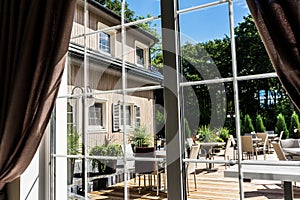 View from inside to the modern summer patio terrace