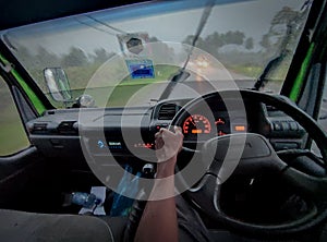 view from inside the truck while driving in heavy rain