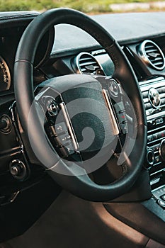 View of the interior of a modern automobile showing the dashboard. Black interior
